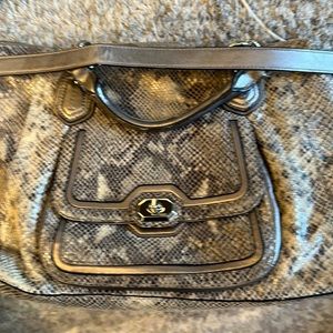 Huge snakeskin Coach bag.